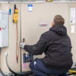 HVAC tech inspecting a commercial HVAC system